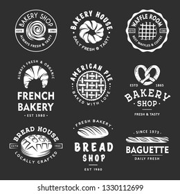 Set of vintage style bakery shop labels, badges, emblems and logo. White graphic art with engraved design elements. Collection of linear graphic on dark background. 