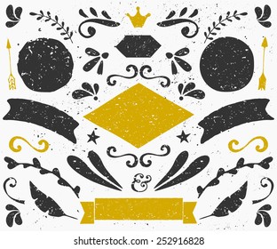 A set of vintage style design elements in dark gray and golden. Hand drawn decorative elements and embellishments. Banners, ribbons, swirls, labels and other retro style graphics.