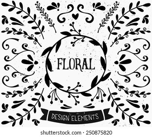 A set of vintage style floral design elements in black and white. Hand drawn decorative elements and embellishments. Borders, laurels, swirls, wreaths and other retro style graphics.