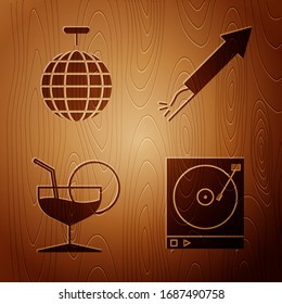 Set Vinyl player with a vinyl disk , Disco ball , Martini glass  and Firework rocket  on wooden background. Vector