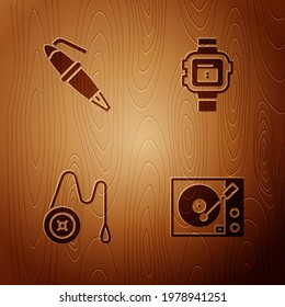 Set Vinyl player, Fountain pen nib, Yoyo toy and Wrist watch on wooden background. Vector