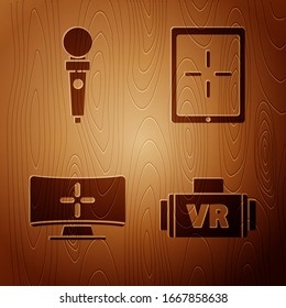 Set Virtual reality glasses, Joystick for arcade machine, Computer monitor and Tablet on wooden background. Vector