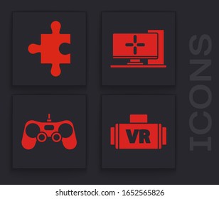 Set Virtual reality glasses, Piece of puzzle, Computer monitor and Gamepad icon. Vector