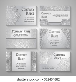 A set of visiting business cards with with circular pattern - like the mandala. Folk patterns.