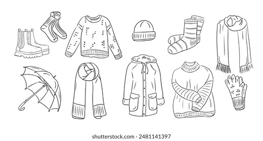 Set of Warm autumn outdoor clothes in outline doodle style. Monochrome hygge contour stickers . Vector clipart of sketchy drawings isolated on white background. Could be used for coloring pages