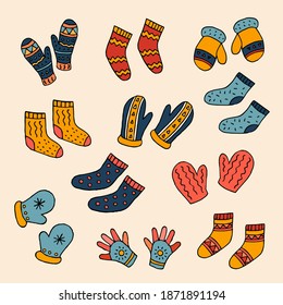 A set of warm socks and knitted mittens. Vector hand-drawn doodle illustration