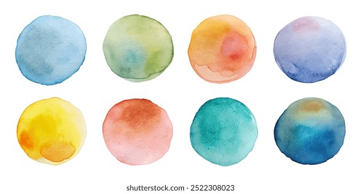 A set of watercolor circles in various colors. The circles are all different sizes and are arranged in a row. The colors of the circles are yellow, green, blue, red, and purple