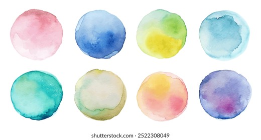 A set of watercolor circles in various colors. The circles are all different sizes and are arranged in a row. The colors of the circles are blue, green, yellow, and pink. Scene is bright and cheerful