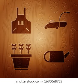 Set Watering lata, Cocina delantal, Plantas en olla y cortadora de césped sobre fondo de madera. Vector