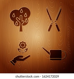 Set Watering can, Tree with pears, Hand holding flower and Gardening handmade scissors for trimming on wooden background. Vector