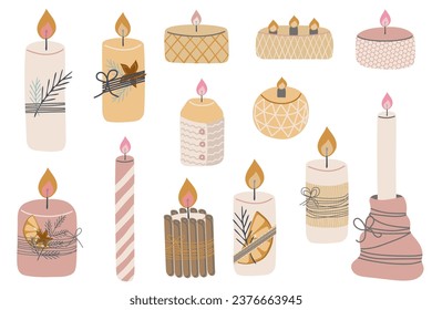 Set of wax Christmas candles with spruce branch and dried orange slice. Winter holiday new year decoration. aroma candle