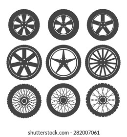 Set of wheels for cars and motorcycles on a white background