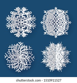 Set of white 3d volume paper snowflakes on dark blue background. Three-dimensional paper cur flakes of snow with shadows