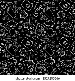 Set of white autumn doodles on a black background, seamless pattern
