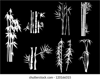 set of white bamboo silhouettes on black background