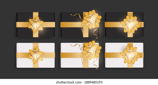 Set of white and black gift boxes with gold ribbon bows. Beautiful realistic gift box template for birthday, christmas, new year design. Top view vector illustration