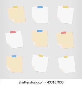 Set of white and brown note paper with folded corners are stuck on gray background