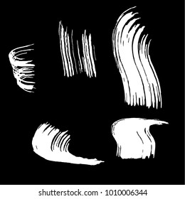 Set of white brush strokes. Dirty artistic design elements.
