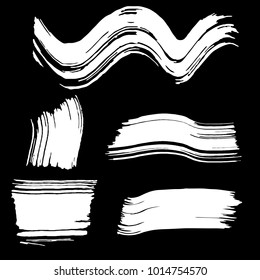 Set of white brush strokes. Dirty artistic design elements.