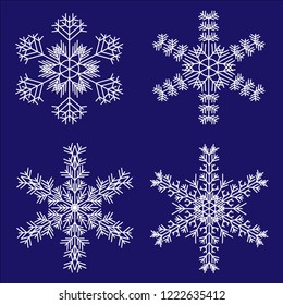 
Set of white complex snowflakes on a dark blue background.