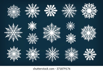 Set of white decorative snowflakes on a dark blue background/Decorative vector Snowflakes set - winter collection clip-art