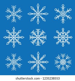 set of white different snowflakes isolated on blue background vector illustration EPS10