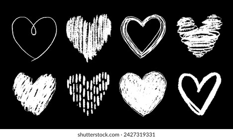 Set of white doodle-style hearts drawn by hand. Grunge scrawls, chalk scribbles, rough brush strokes, underlines and circles. Bold charcoal freehand hearts. Crayon or marker scribbles