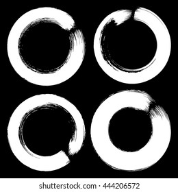 Set of white grunge brushstroke circles on black background vector illustration. Abstract hand drawn grunge banners