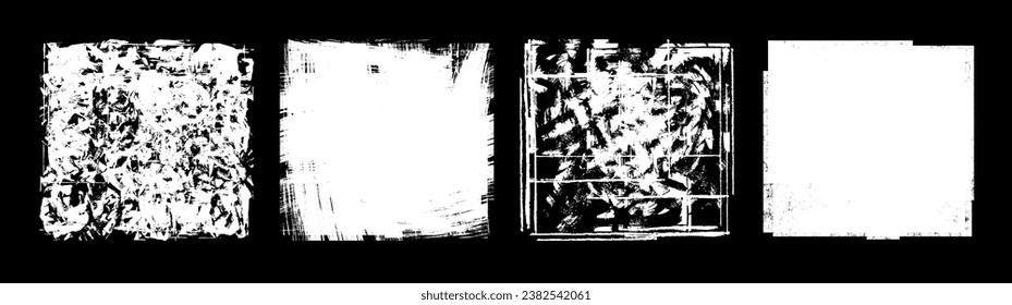 A set of white grunge textures isolated on a black background