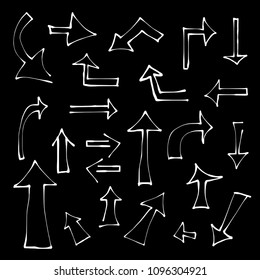 Set of white hand drawn arrows on black background. Pointer vector illustration.