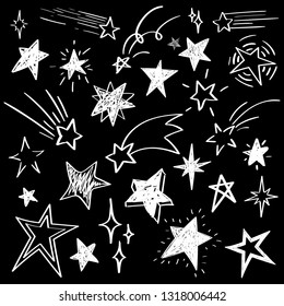 Set of white hand drawn vector stars in doodle style isolated on black background. Could be used as pattern element, cards, childish design