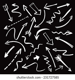 Set of white hand-drawn arrows on a black background. Vector outline illustration.