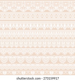 Set of white lace borders isolated on beige background