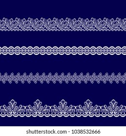 set of white lace ribbons on a blue background