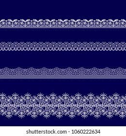 set of white lace ribbons on a blue background