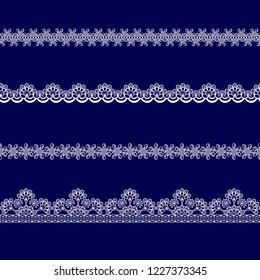 set of white lace ribbons on a blue background