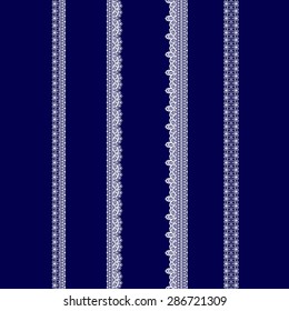 set of white lace ribbons on a blue background