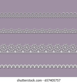 set of white lace ribbons on a pink background