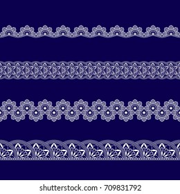set of white lace ribbons on a blue background