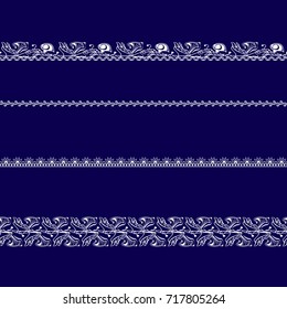 set of white lace ribbons on a blue background