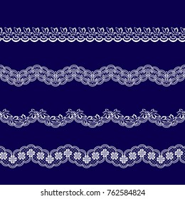 set of white lace ribbons on a blue background