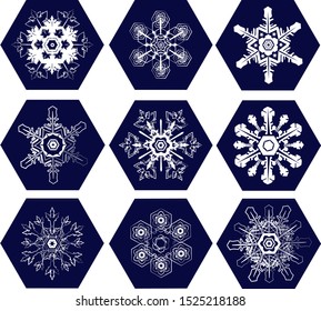 set of white lace snowflakes inscribed in dark blue hexagons, set of tiles with openwork snowflakes
