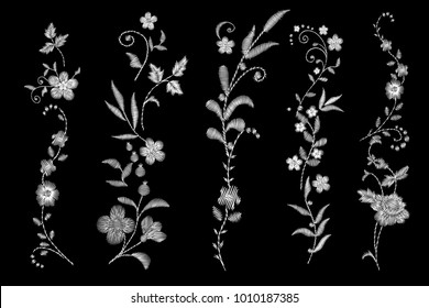 set of white lace. Traditional folk flower fashionable embroidery on the black background. A bouquet of roses and a dog rose, for printing on clothes, vector