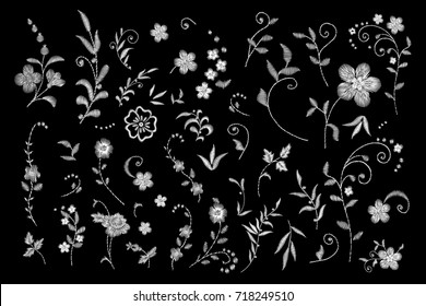 set of white lace. Traditional folk flower fashionable embroidery on the black background. A bouquet of roses and a dog rose, for printing on clothes, vector