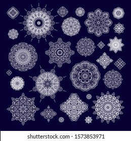 Set of white laced  vector decorative rosettes mandalas, snowflakes  on dark  background