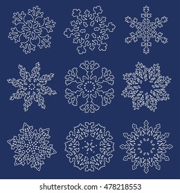 Set of white linear snowflakes isolated on blue background. Vector illustration.