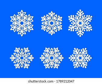 Set of white openwork snowflakes on a blue background. Vector silhouette, design template for holiday greeting card, banner, poster, laser and plotter cutting, Christmas design and festive decoration