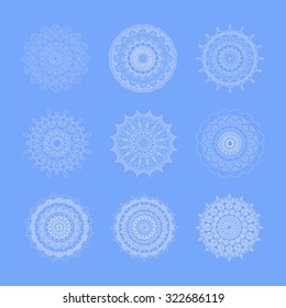 Set of white outline hand drawn mandalas. Round ornament patterns.