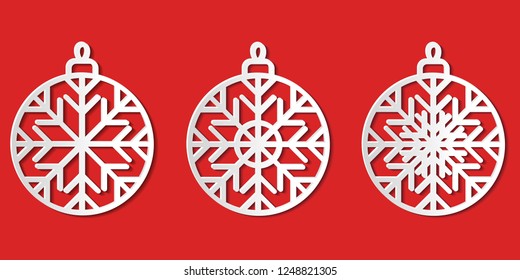 Set of white paper cut graphic vector Christmas bauble icons isolated decorated with snowflakes; Christmas ball signs cut out from paper on red background; template for laser and plotter cutting.