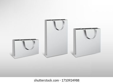 Set of white paper different size bags with silk rope. High resolution illustration. Isolated on white background. 